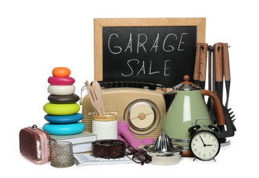 Photo of Blackboard with sign Garage Sale and many different stuff isolated on white
