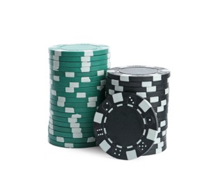 Photo of Plastic casino chips stacked on white background. Poker game