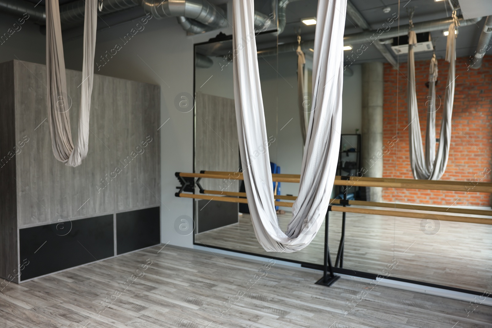 Photo of Many hammocks for fly yoga in studio