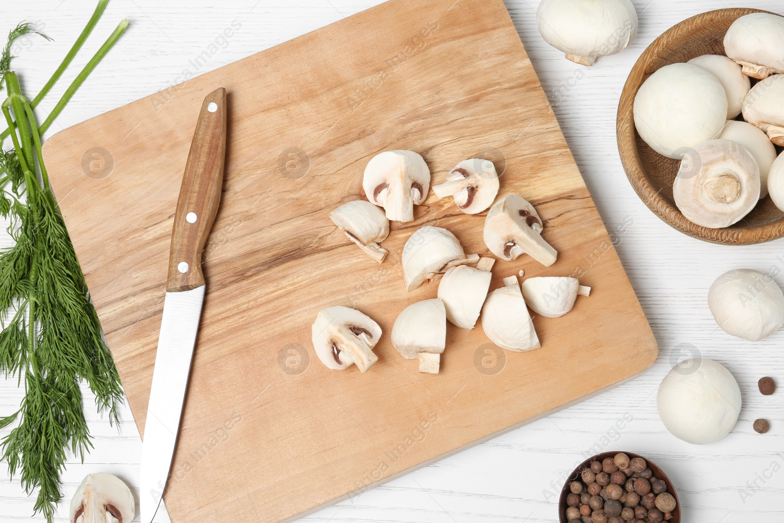 Photo of Flat lay composition with fresh champignon mushrooms on wooden table