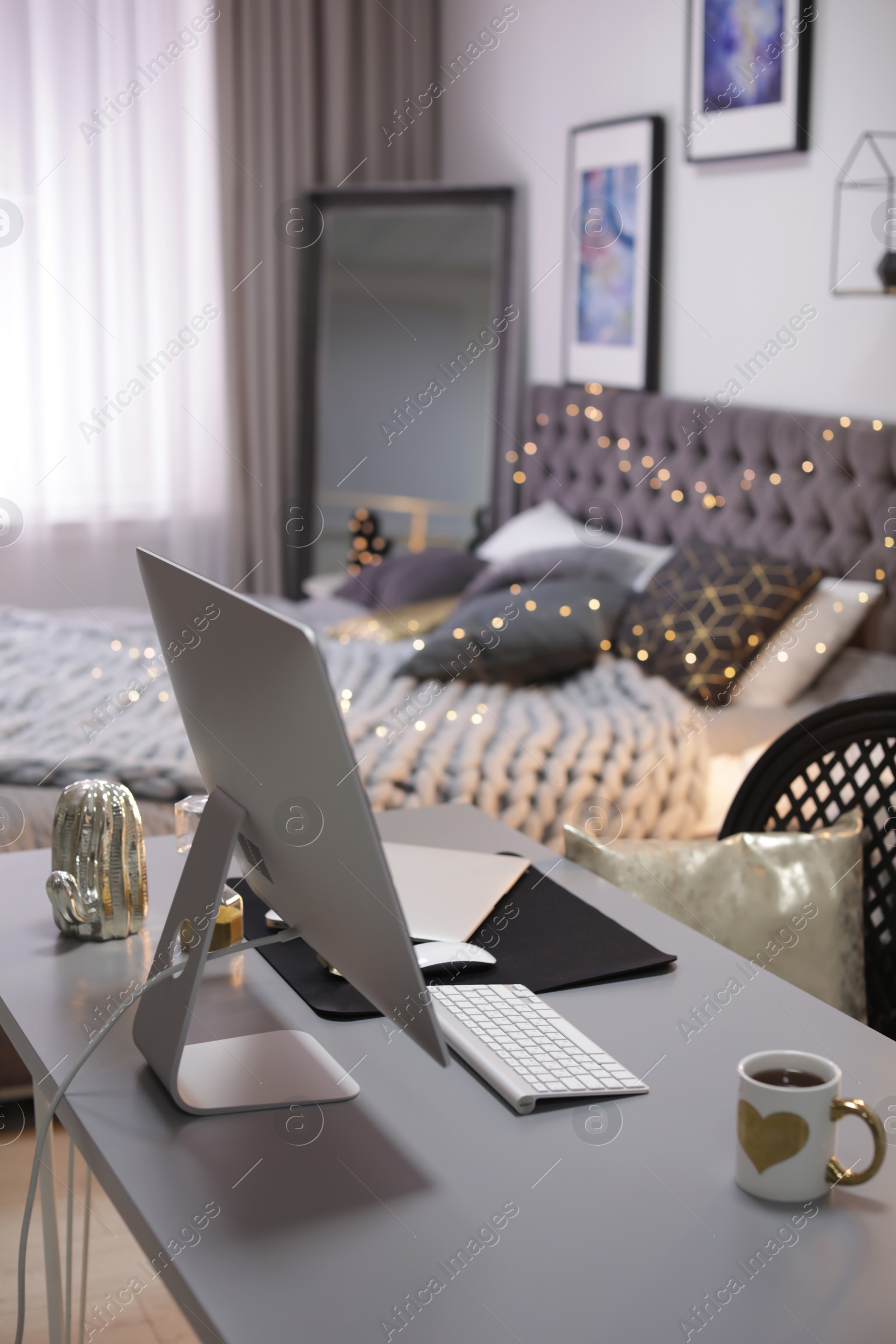 Photo of Stylish workplace interior with modern computer on desk