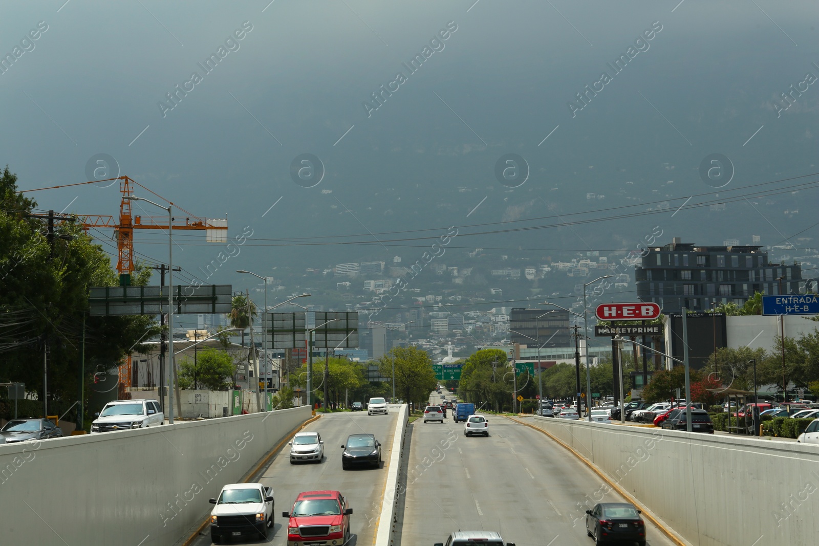 Photo of SAN PEDRO GARZA GARCIA, MEXICO - AUGUST 29, 2022: Cars in traffic jam on city street, aerial view