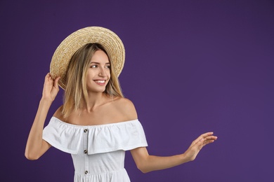 Photo of Young woman wearing stylish white dress on purple background. Space for text