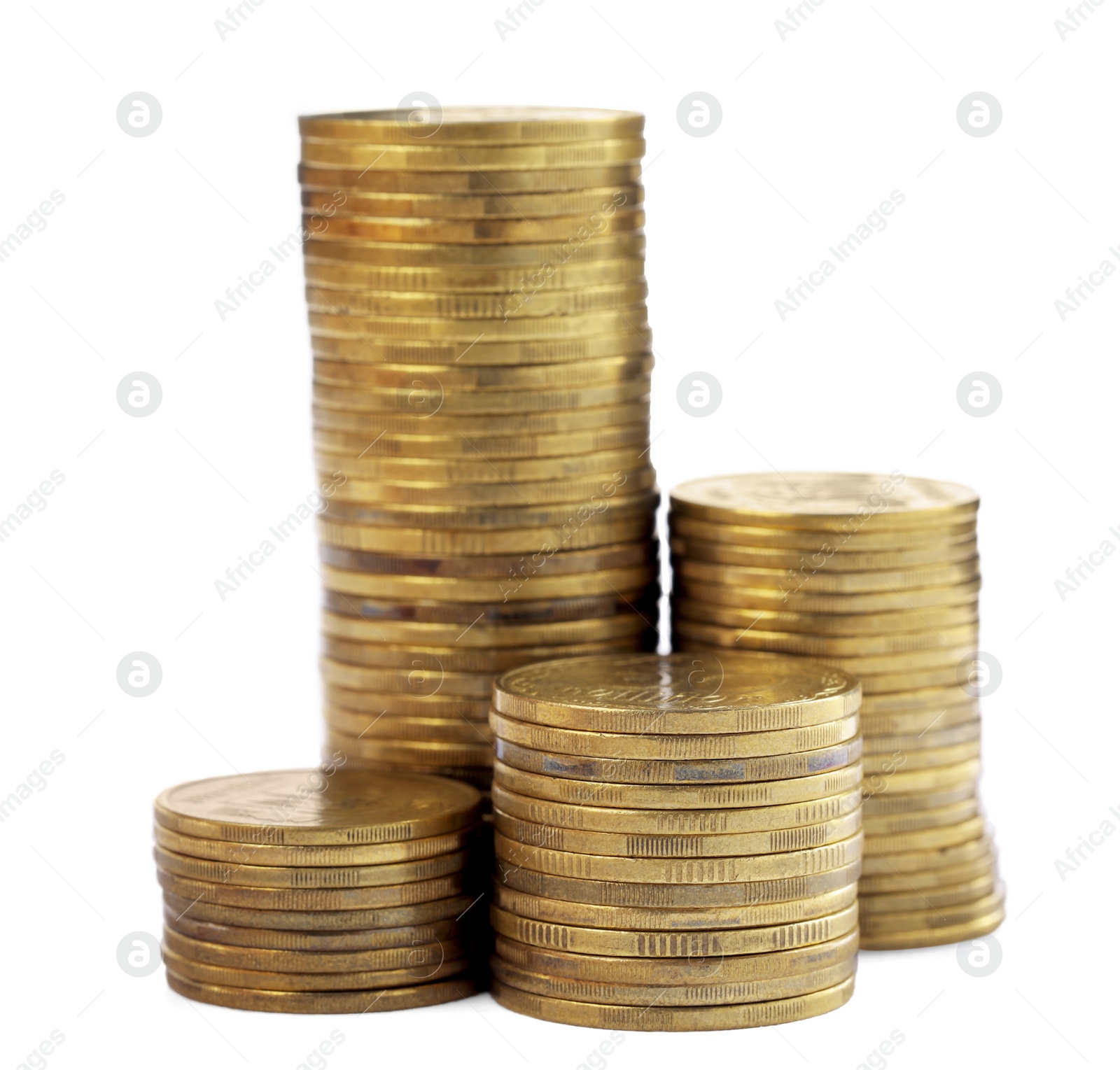 Photo of Many golden coins stacked on white background