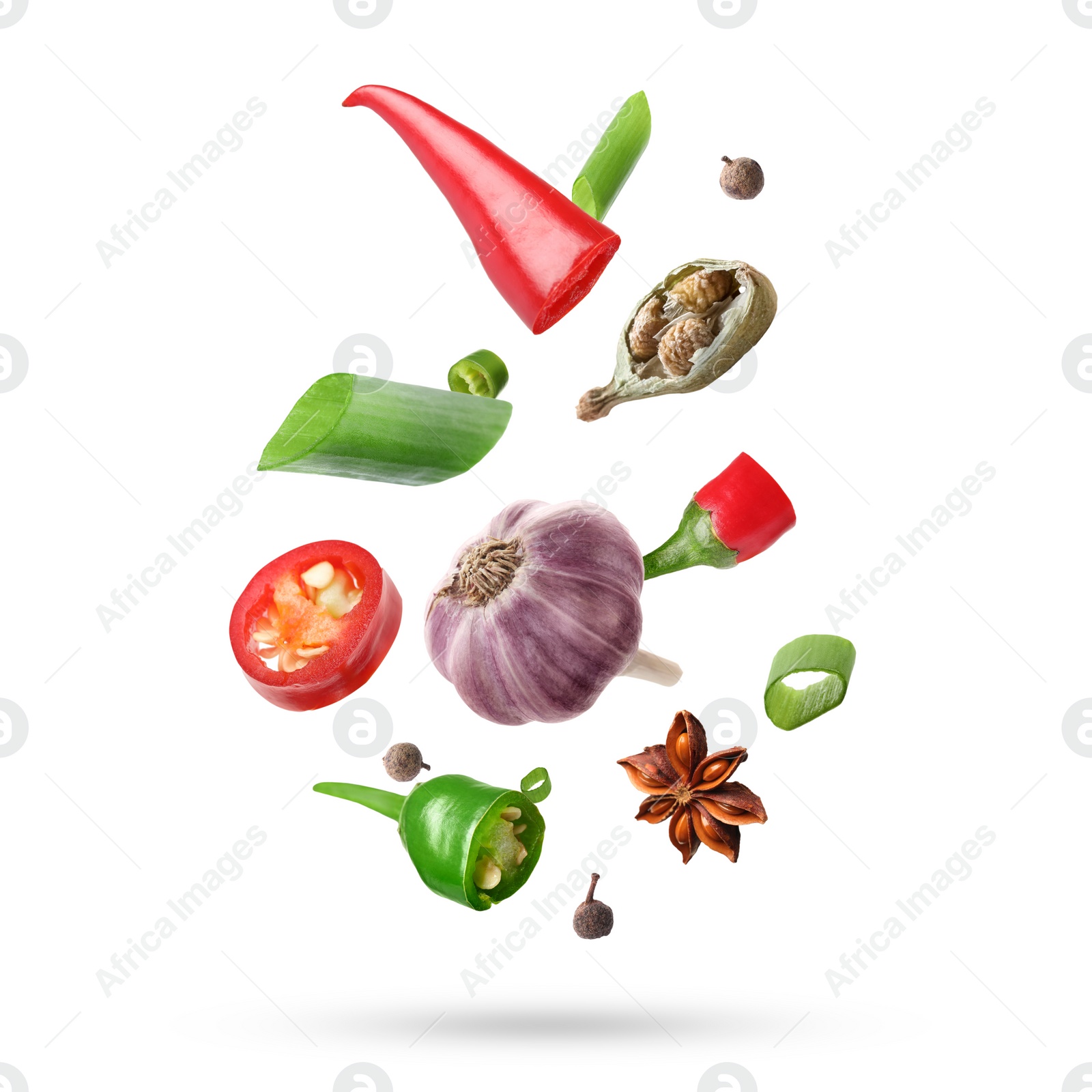 Image of Different aromatic spices falling on white background