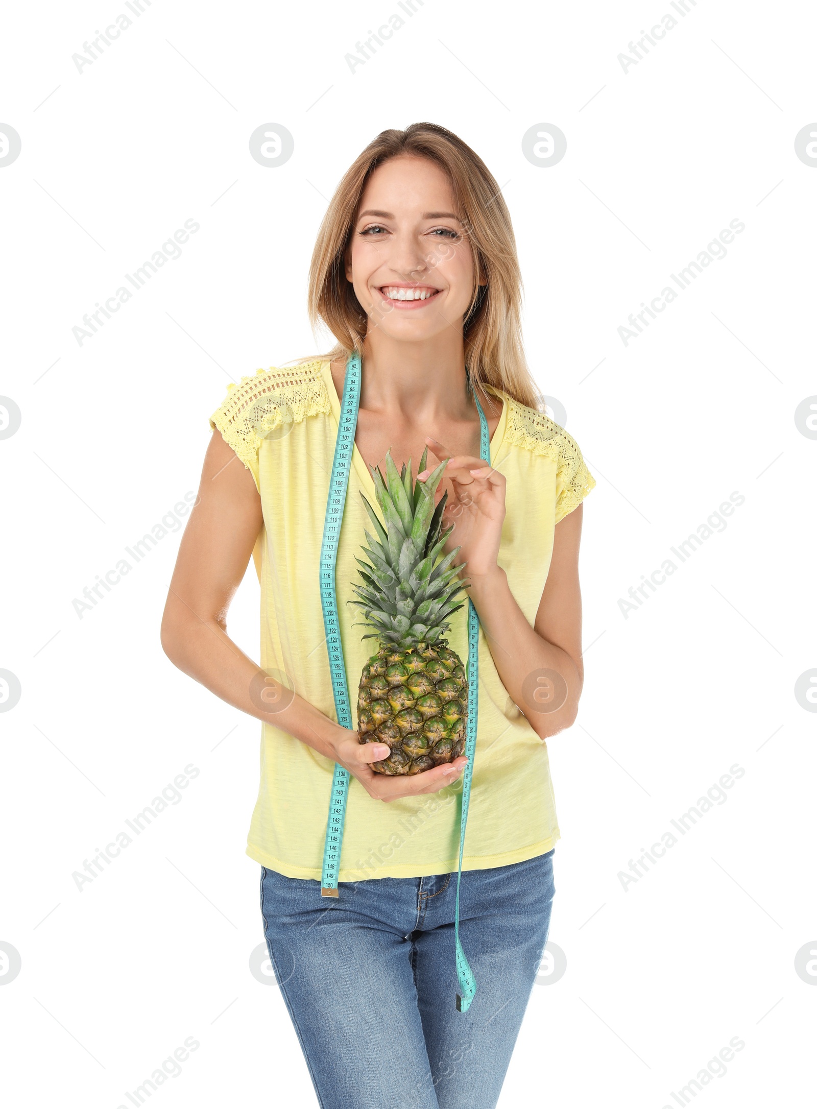 Photo of Happy slim woman with measuring tape and pineapple on white background. Positive weight loss diet results