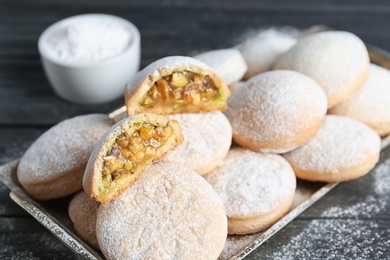 Traditional cookies for Islamic holidays on wooden table, closeup. Eid Mubarak