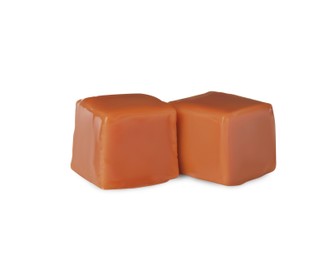 Photo of Two sweet caramel candies on white background