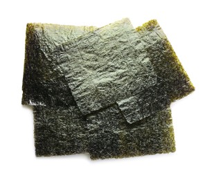 Photo of Dry nori sheets on white background, top view