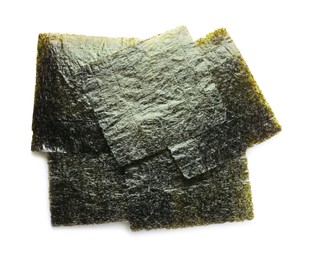 Dry nori sheets on white background, top view