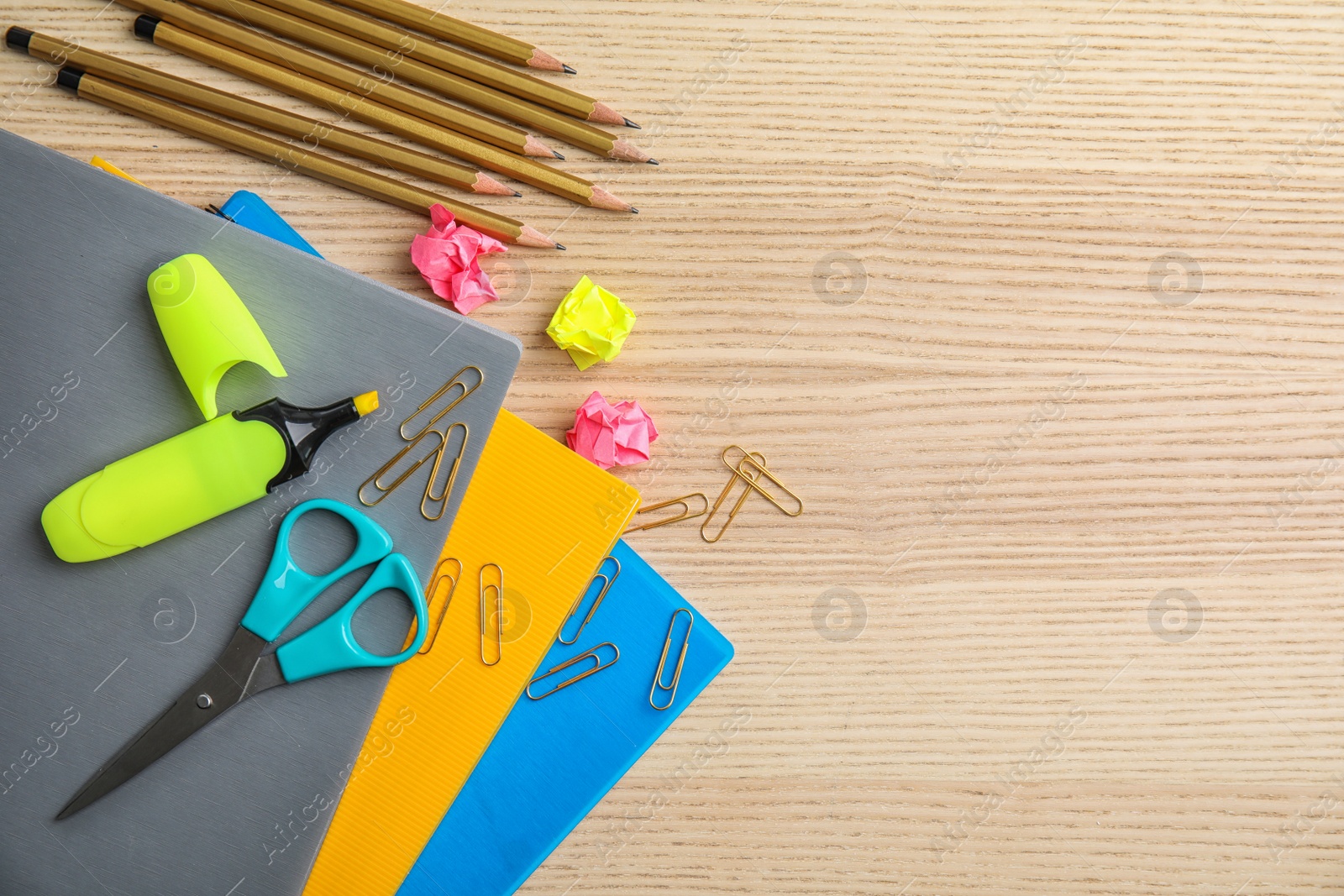 Photo of Flat lay composition with different school stationery on wooden background