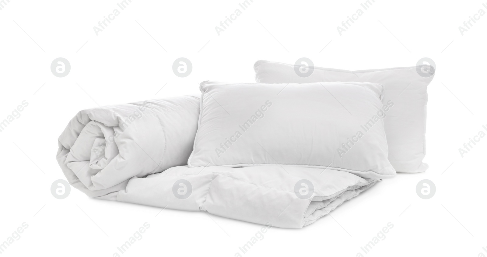 Photo of Soft blanket with pillows on white background