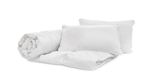 Photo of Soft blanket with pillows on white background