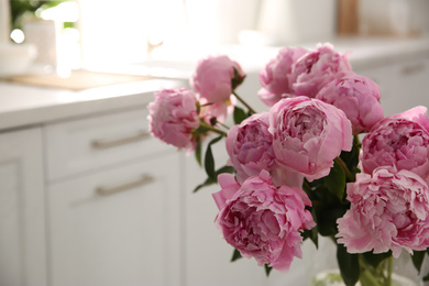 Photo of Bouquet of beautiful fresh pink peonies indoors, closeup