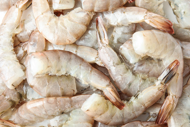 Photo of Fresh raw shrimps as background, top view