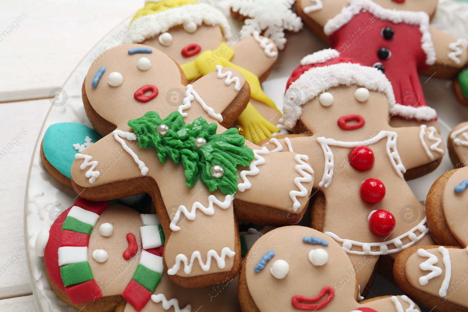 Photo of Delicious Christmas cookies on white table, closeup