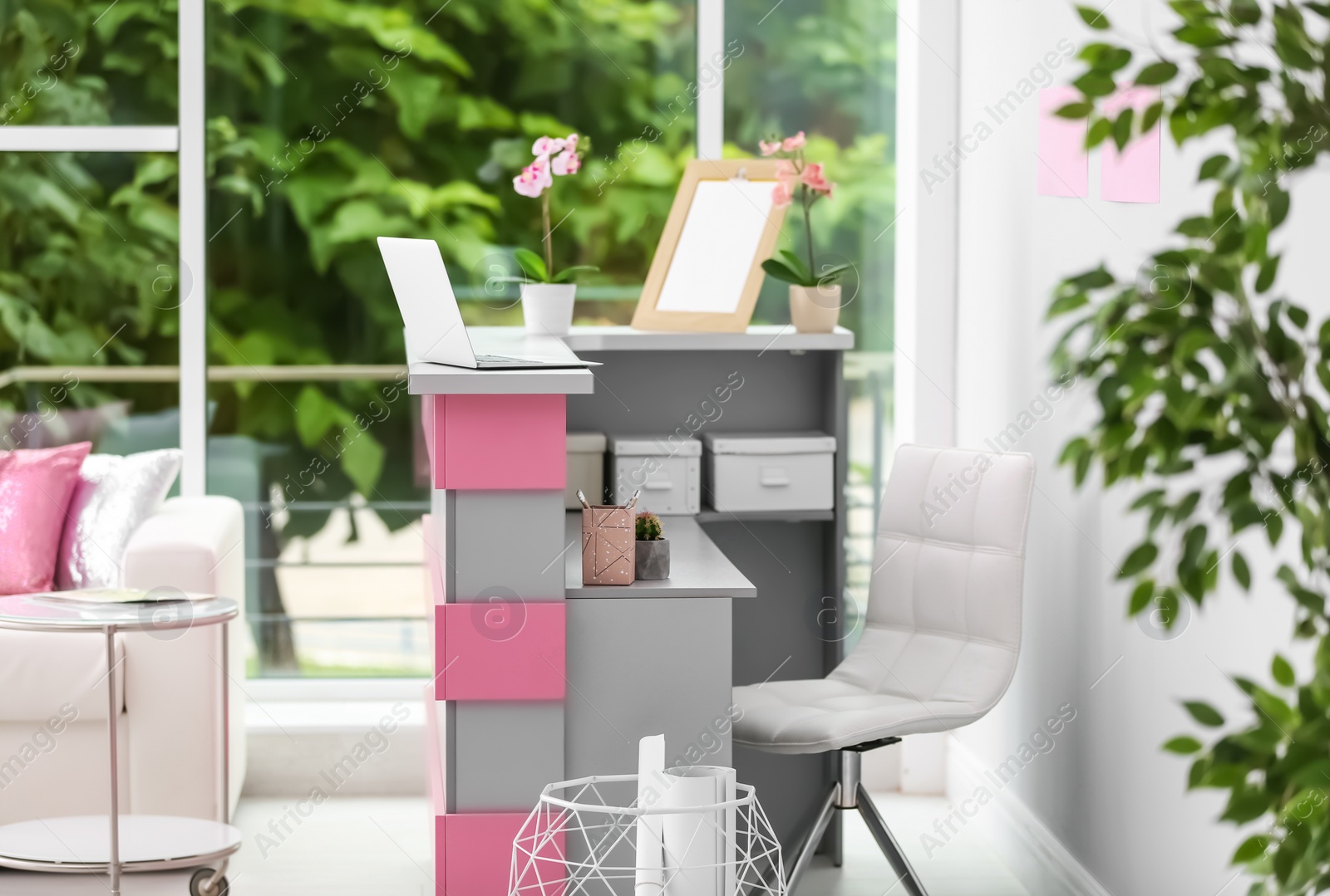 Photo of Reception desk in beauty salon. Stylish interior