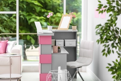 Photo of Reception desk in beauty salon. Stylish interior