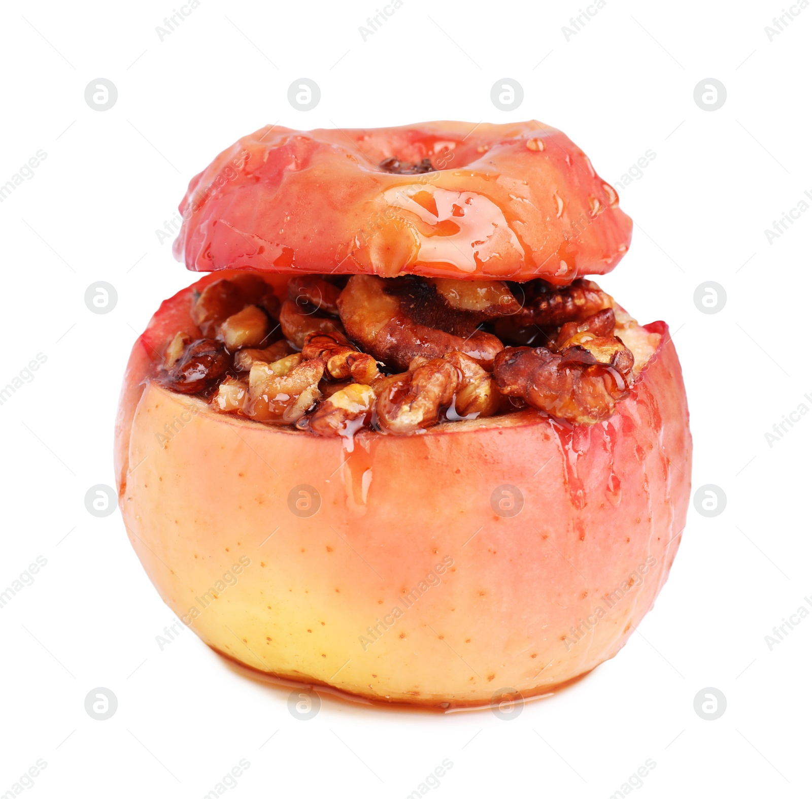 Photo of Tasty baked apple with nuts isolated on white