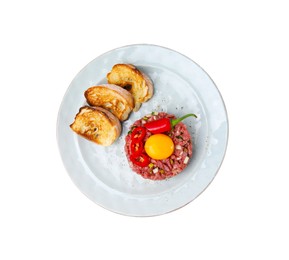Photo of Tasty beef steak tartare served with yolk, toasted bread and other accompaniments isolated on white, top view