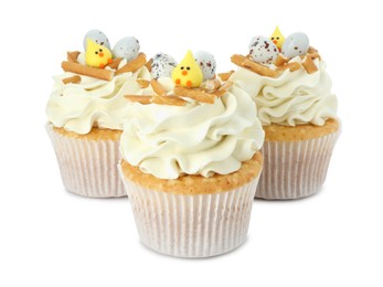 Photo of Tasty Easter cupcakes with vanilla cream isolated on white