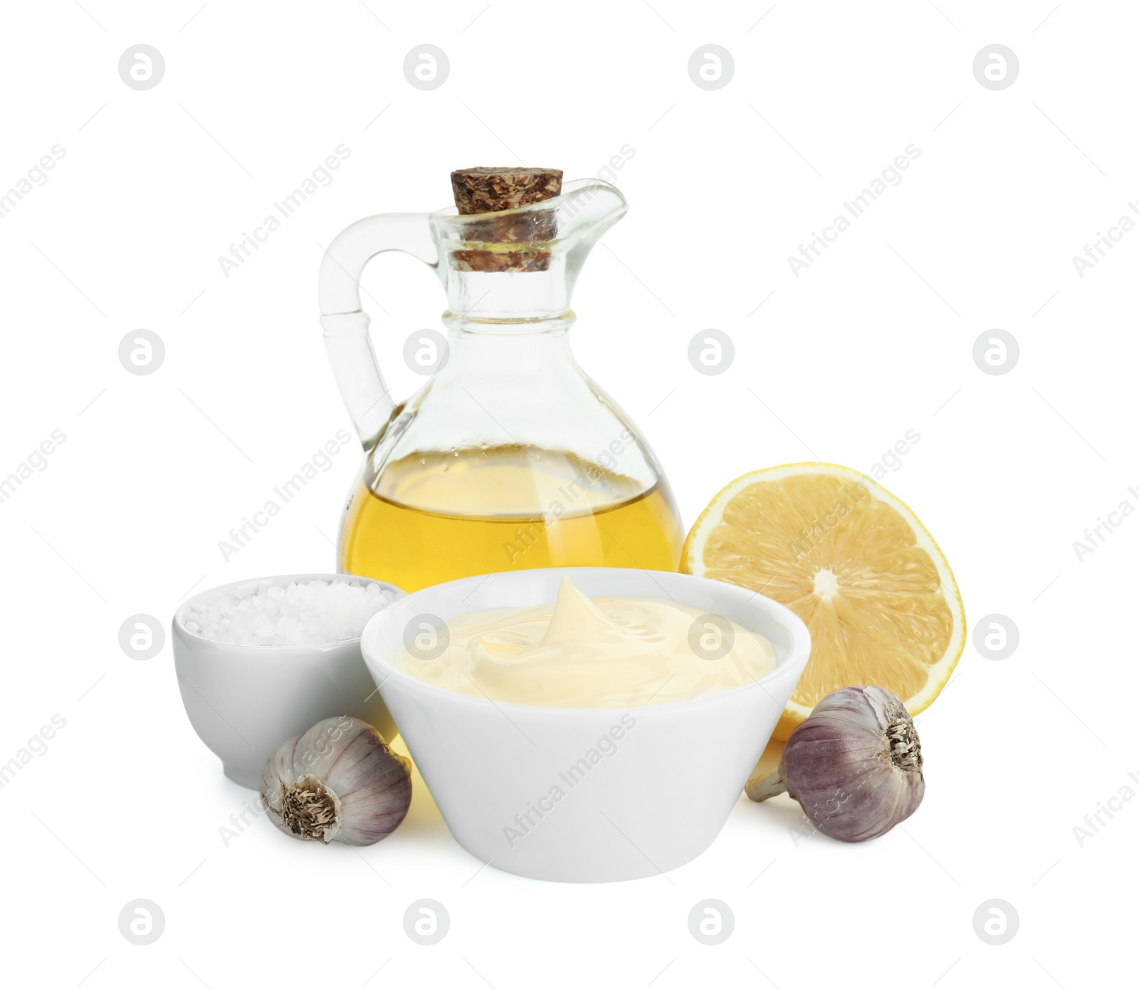 Photo of Fresh mayonnaise sauce in bowl and ingredients isolated on white