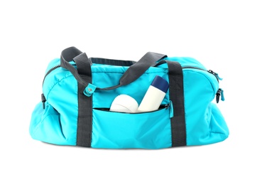 Photo of Sport bag with deodorants on white background