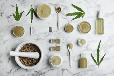 Photo of Flat lay composition with hemp lotion on marble background