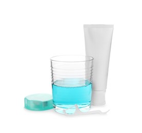 Photo of Mouthwash, dental floss and toothpaste on white background
