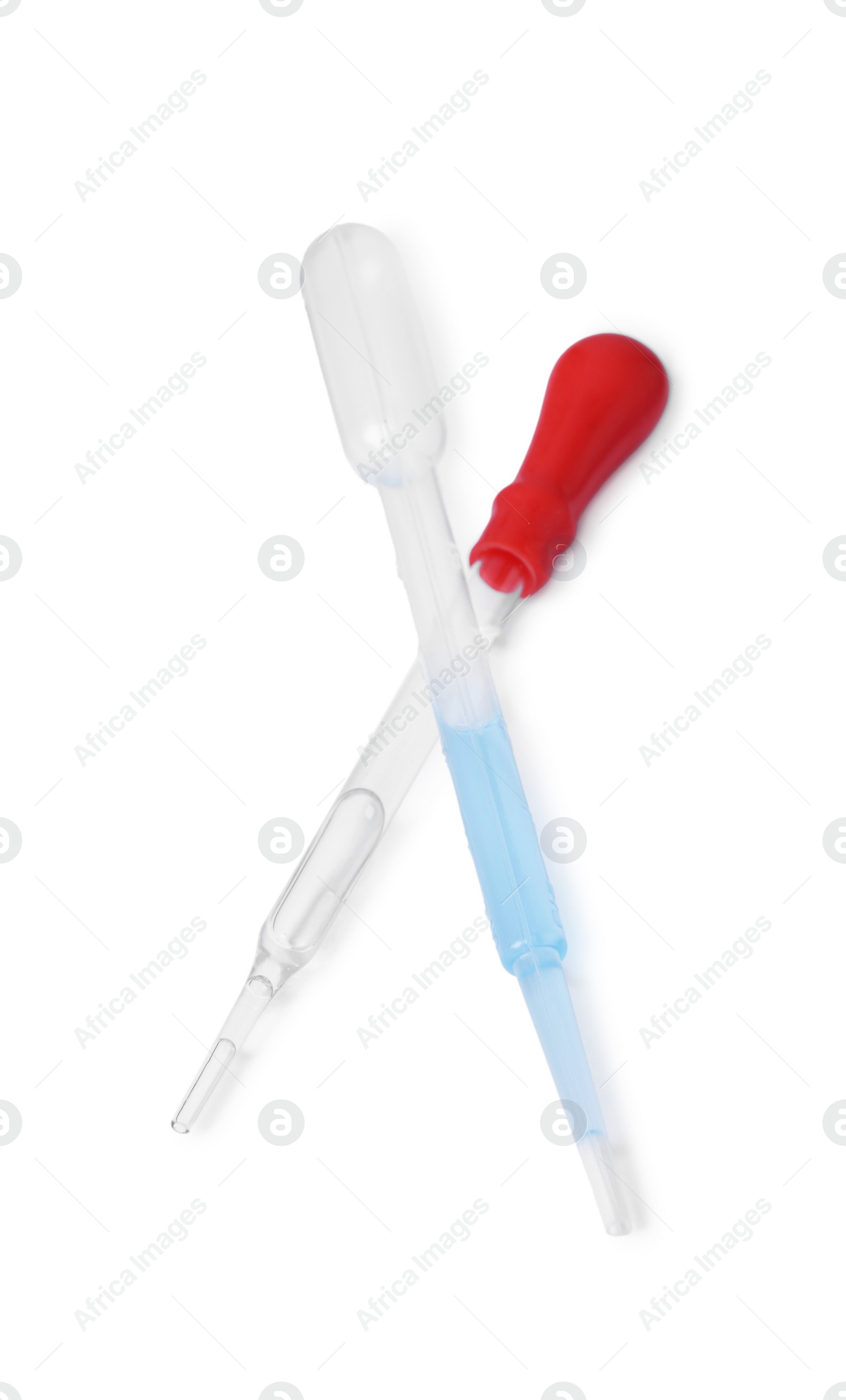 Photo of Two pipettes with liquid isolated on white