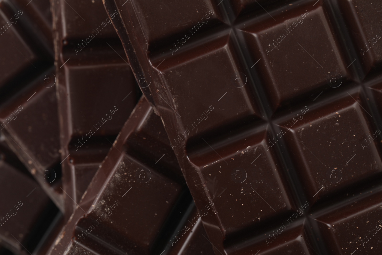 Photo of Delicious dark chocolate as background, closeup view