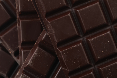 Photo of Delicious dark chocolate as background, closeup view