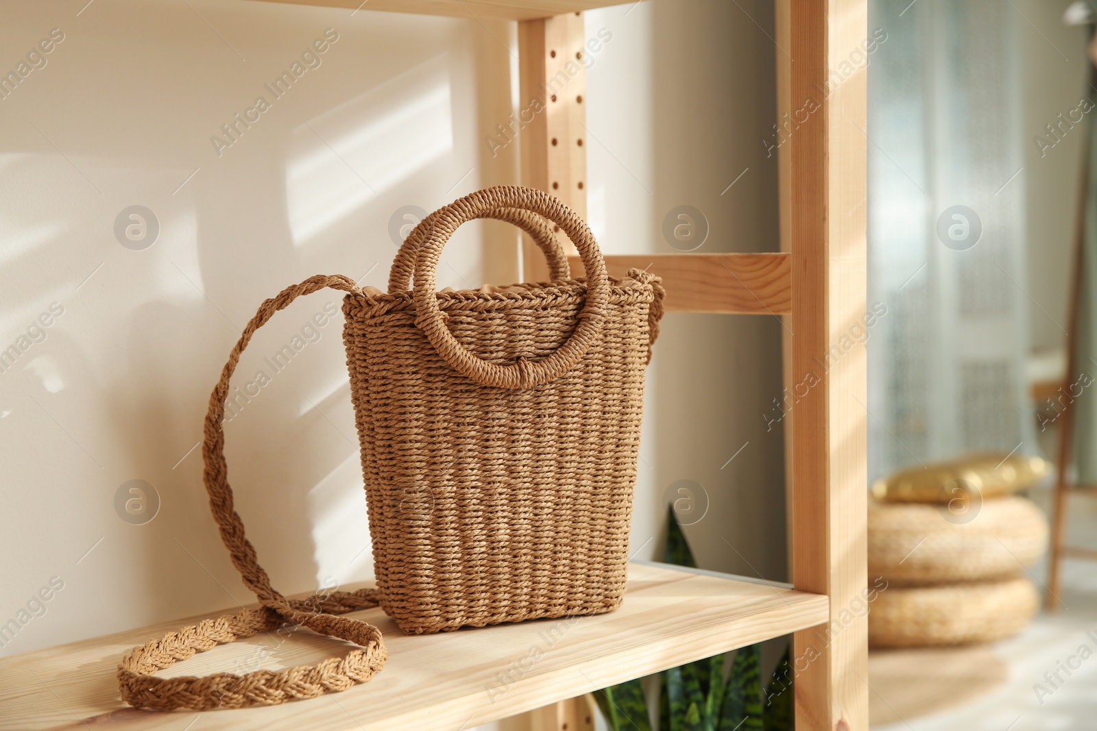 Photo of Stylish woman's bag on shelf in boutique