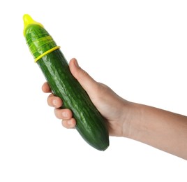 Photo of Woman holding cucumber in condom on white background, closeup. Safe sex concept