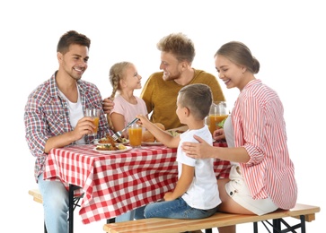 Happy family having picnic at table on white background