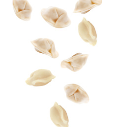 Many tasty dumplings falling on white background