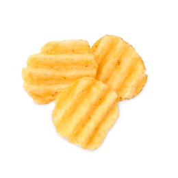 Delicious ridged potato chips on white background, top view