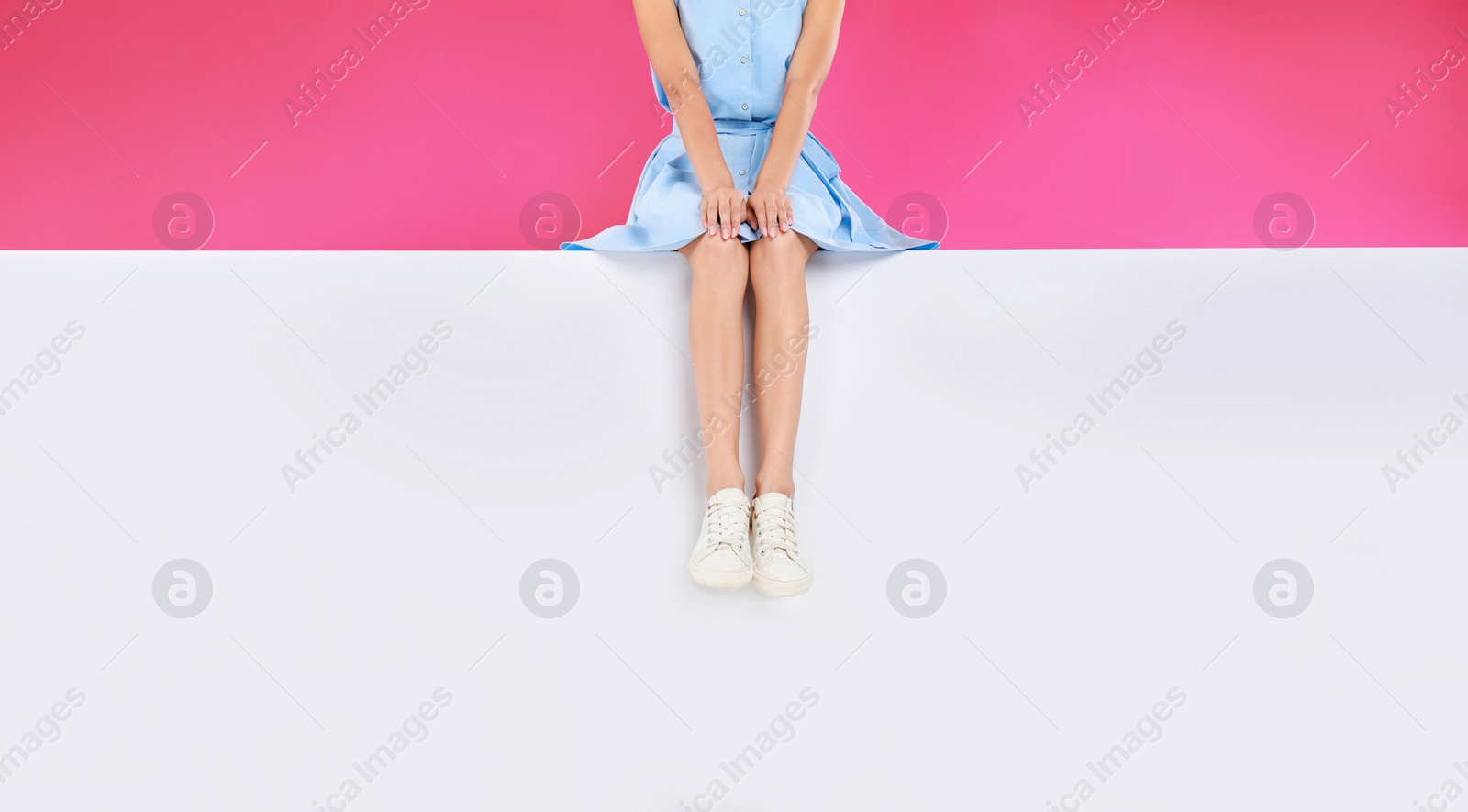 Photo of Woman wearing stylish shoes on color background, closeup