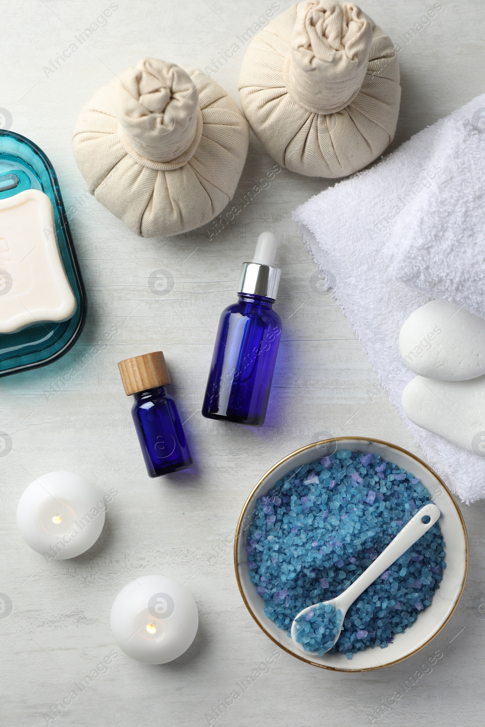 Photo of Flat lay composition with spa products on light wooden table