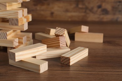 Photo of Wooden Jenga blocks on table, closeup. Board game