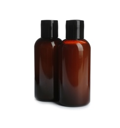 Photo of Mini bottles with cosmetic products on white background. Hotel amenities