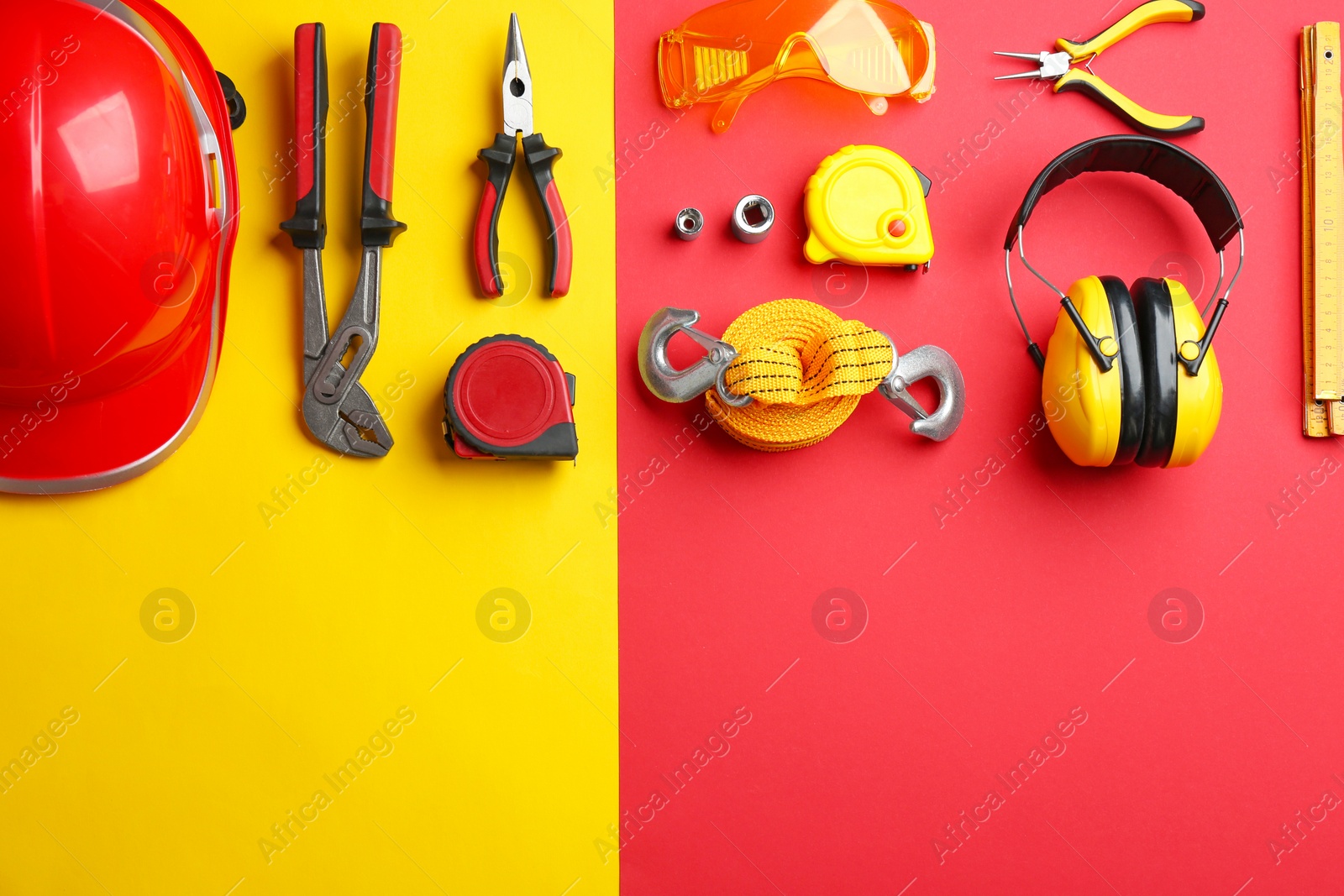 Photo of Flat lay composition with construction tools on color background, space for text