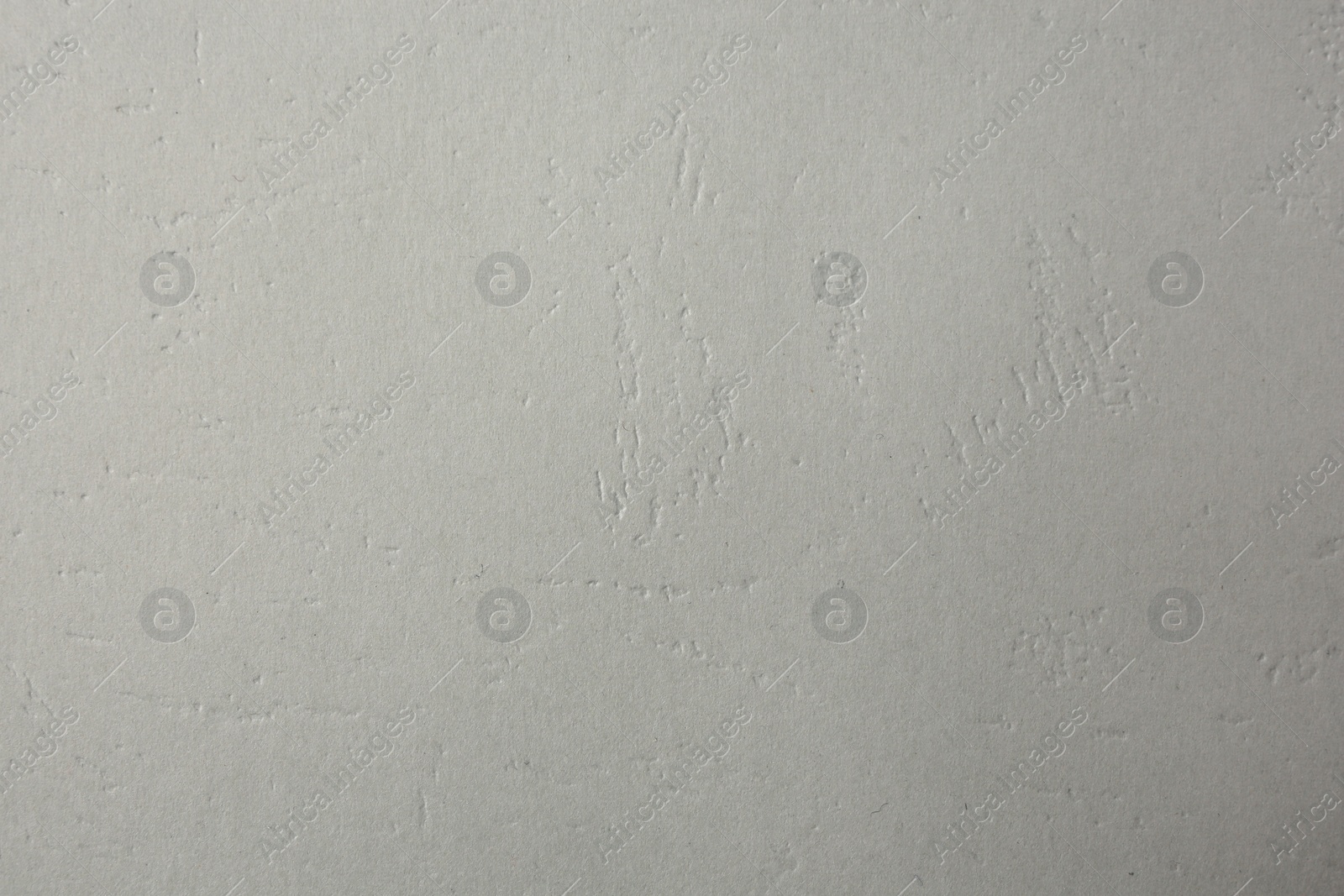 Photo of Texture of light grey paper sheet as background, closeup