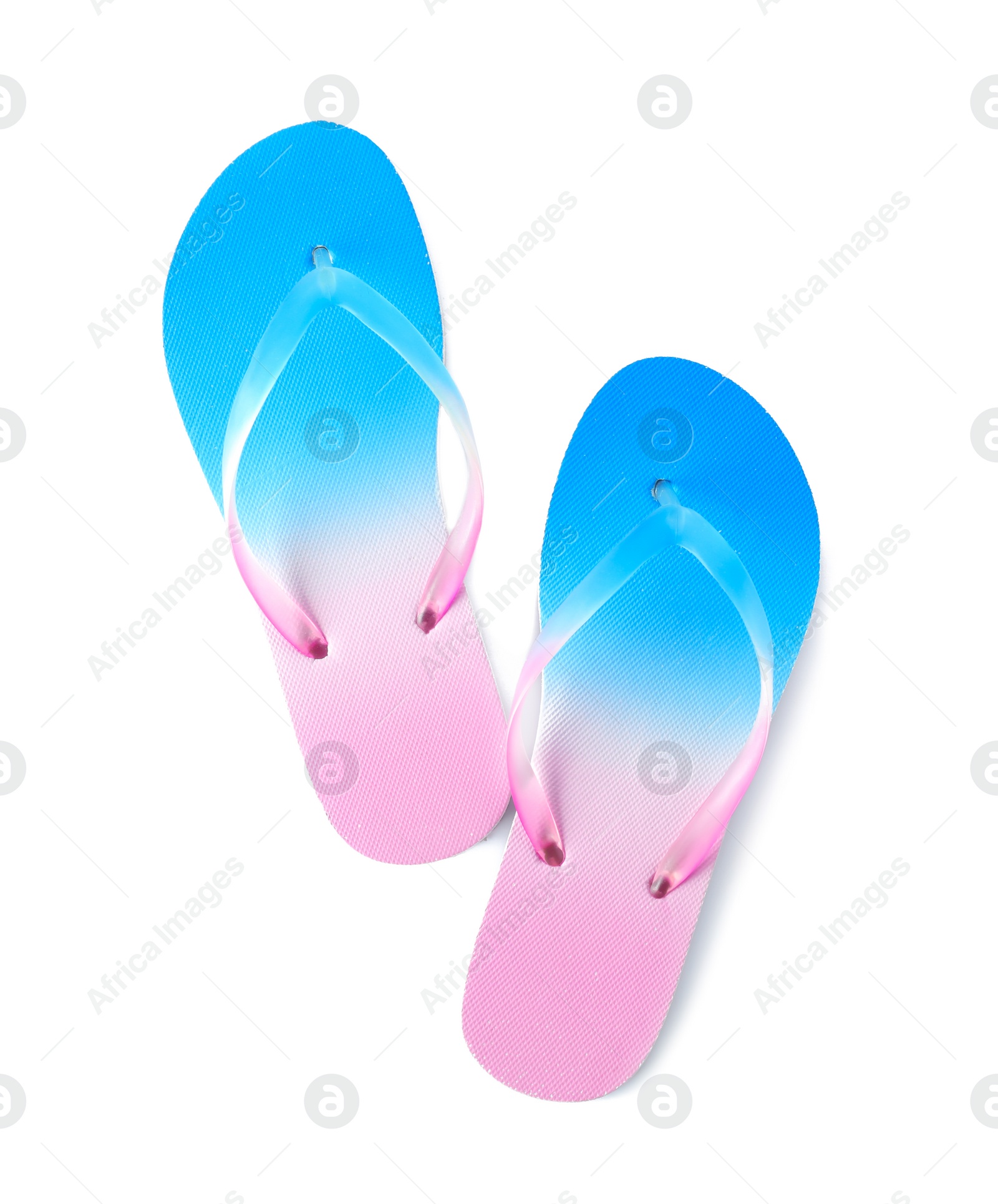 Photo of Bright flip flops on white background. Beach object