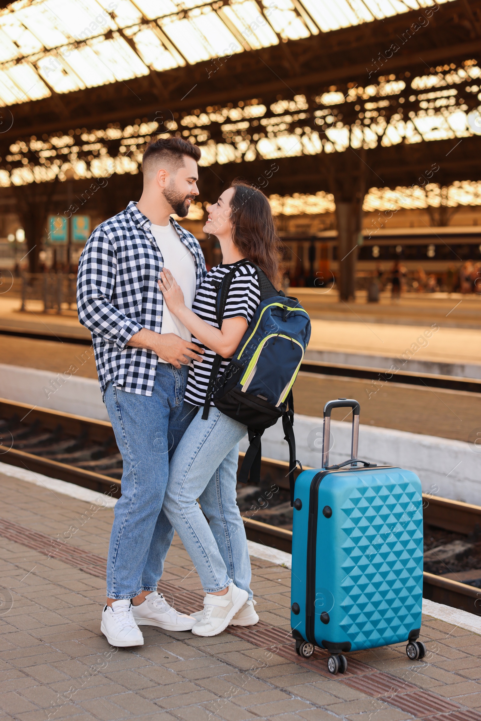 Photo of Long-distance relationship. Beautiful couple on platform of railway station