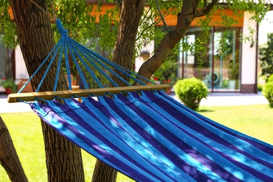 Comfortable blue hammock outdoors on sunny day