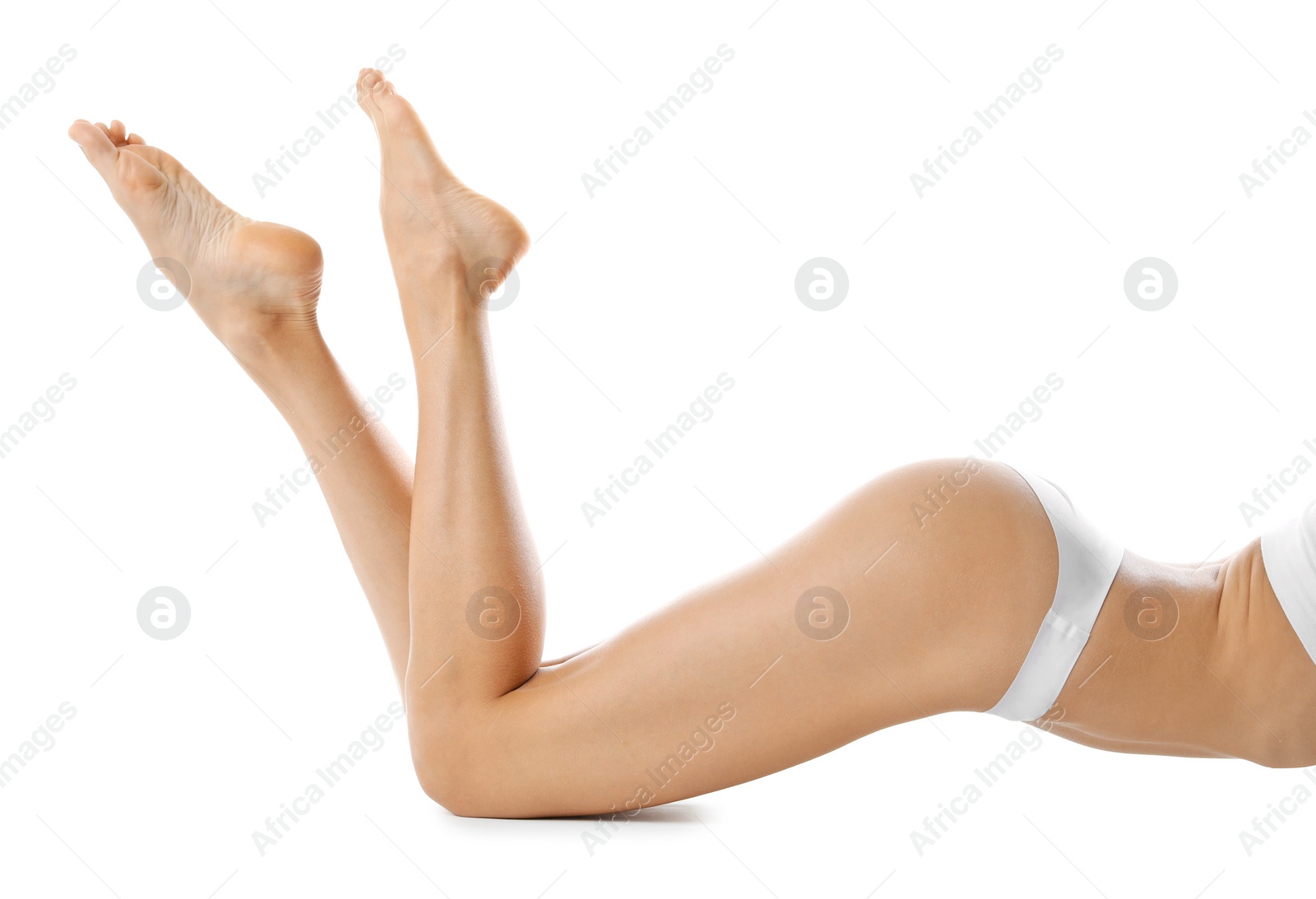 Photo of Young woman with beautiful long legs on white background, closeup