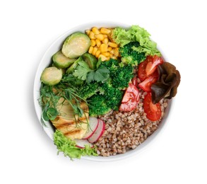 Healthy meal. Tasty vegetables and buckwheat in bowl isolated on white, top view