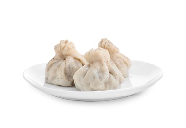 Photo of Plate with three tasty khinkali (dumplings) and spices isolated on white. Georgian cuisine