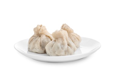 Plate with three tasty khinkali (dumplings) and spices isolated on white. Georgian cuisine